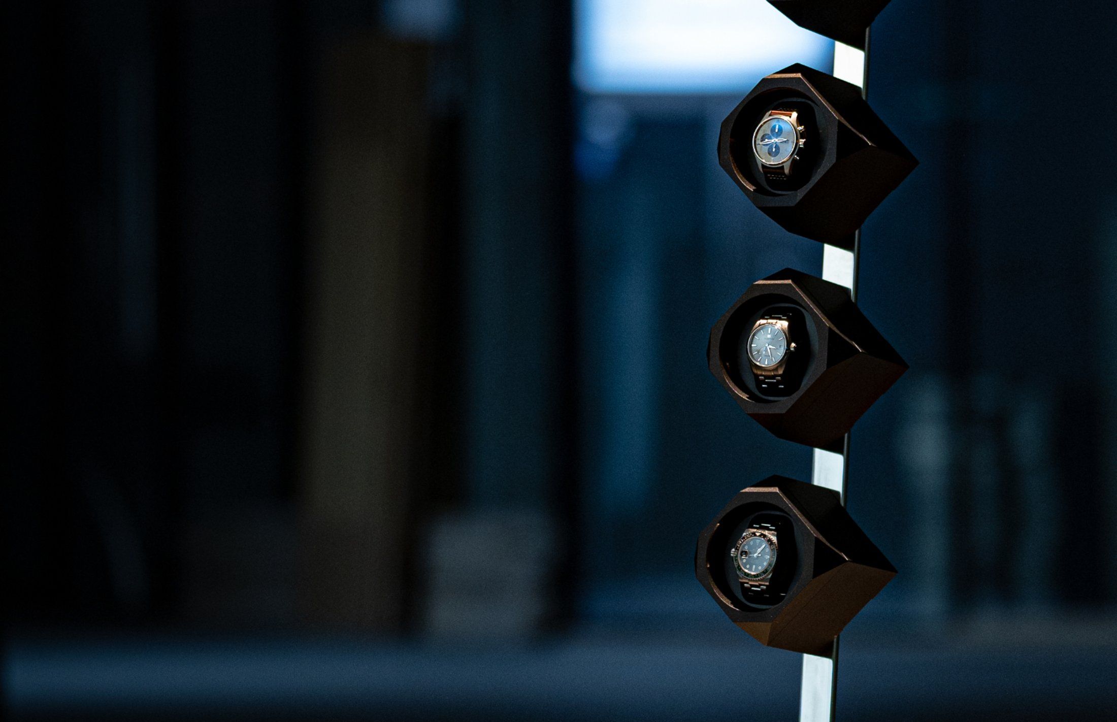 Time Machine winders on their floor stand in a dark interior
