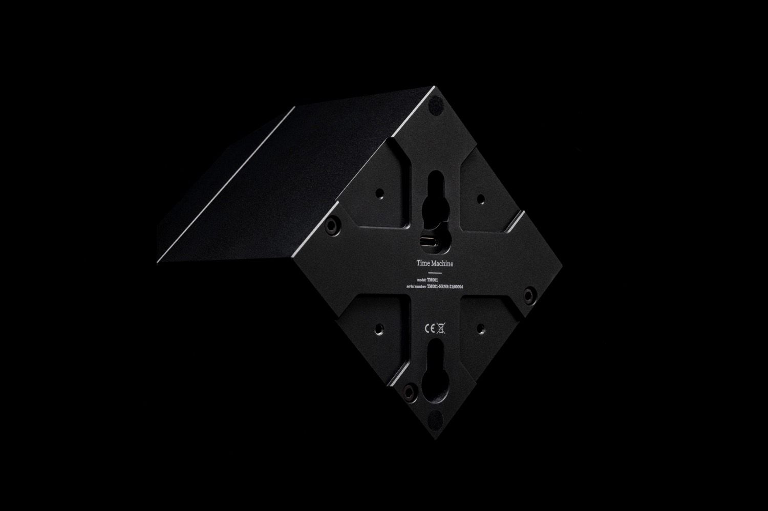 Back plate of the Time Machine winder with keyhole wall mounts