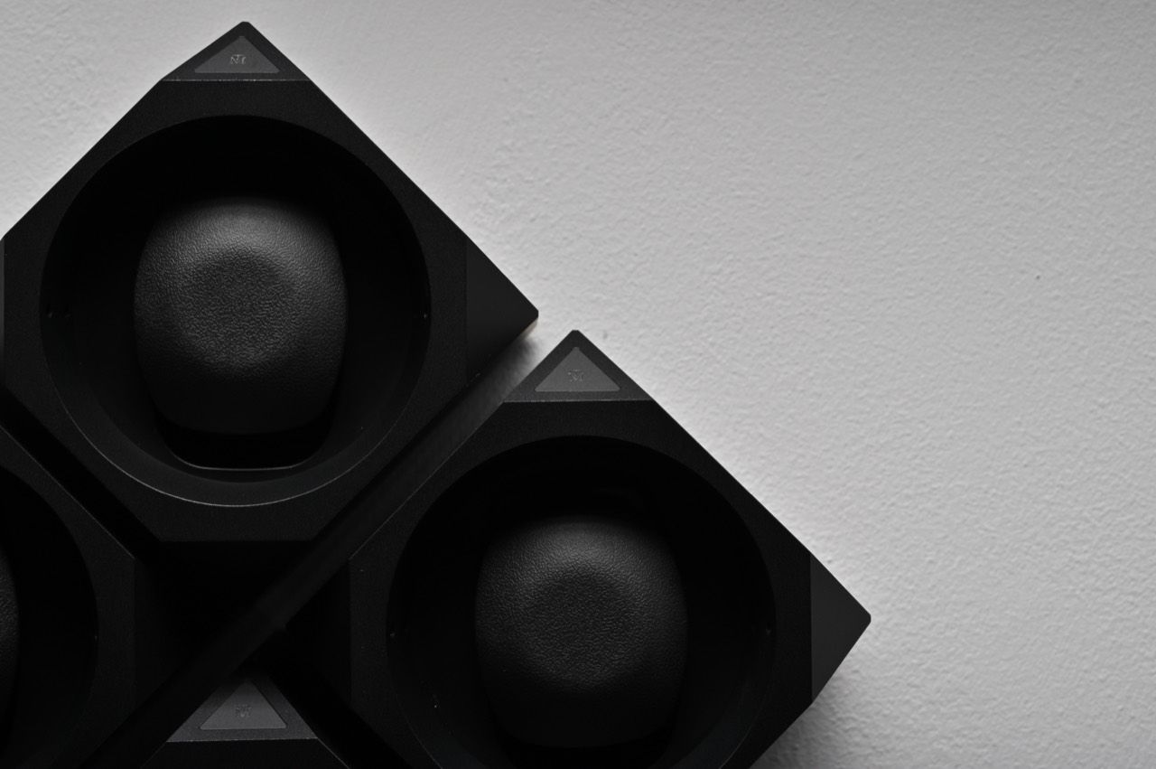 Time Machine winder photographed from the side on a light studio background